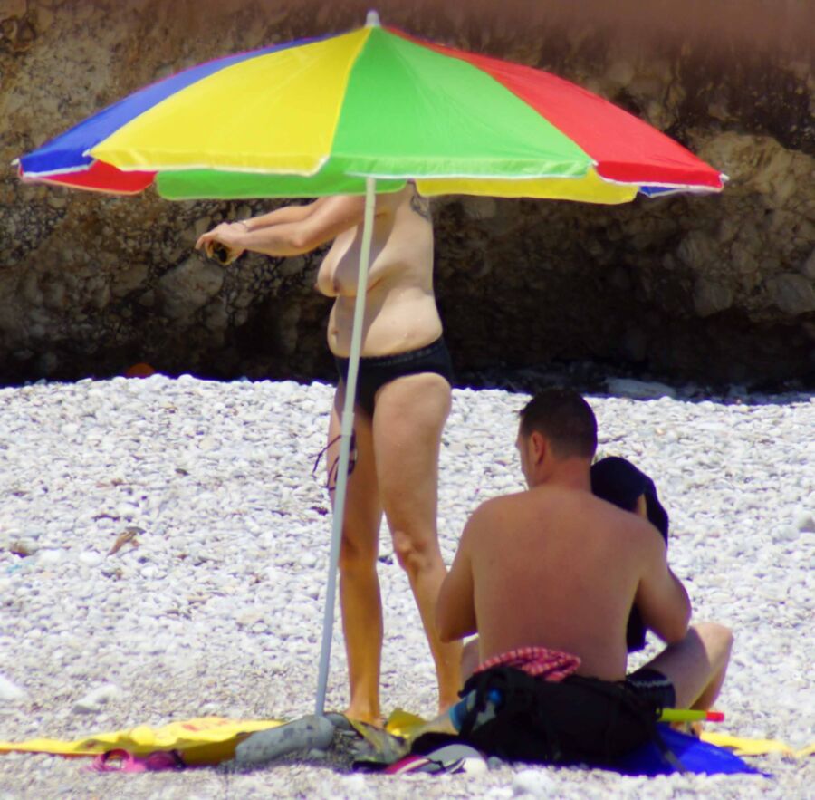 Free porn pics of Glimpses of Tit Meat on the beach 7 of 8 pics