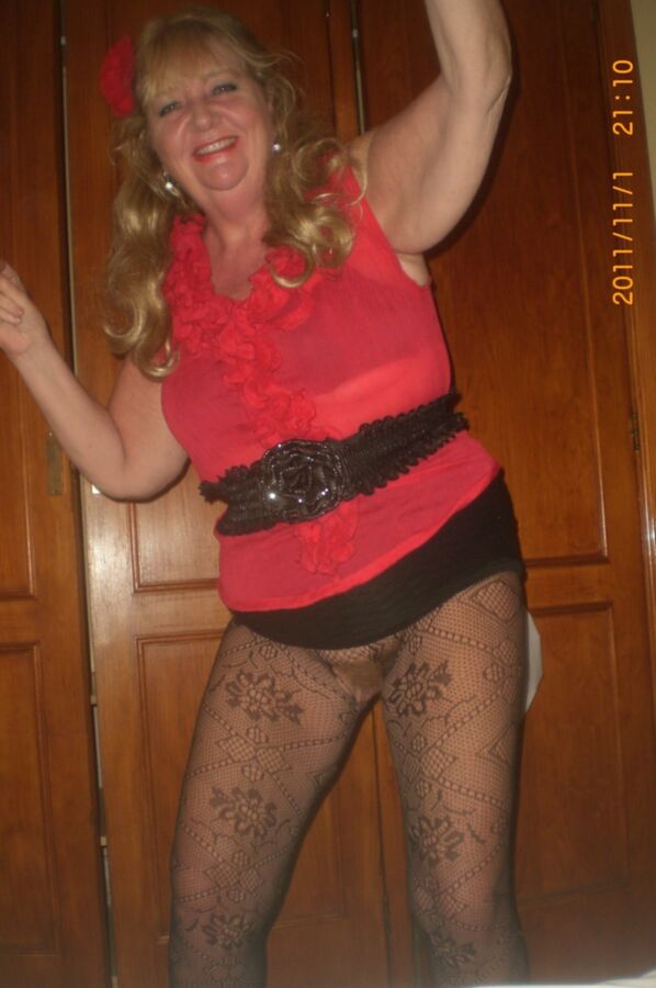 Free porn pics of goldenpussy wearing red blouse and fishnet pantyhose 1 of 10 pics